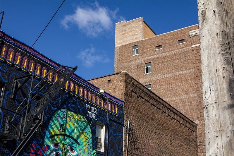 A picture of a side of a building with a mural